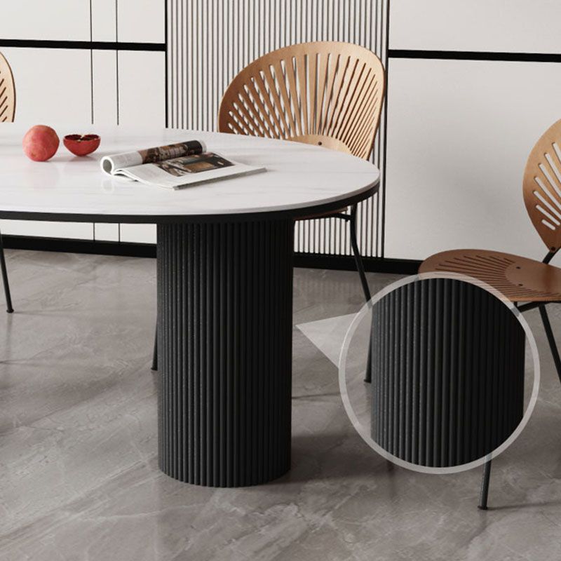 Table de salle à manger ovale moderne avec dessus en pierre et double piédestal en métal