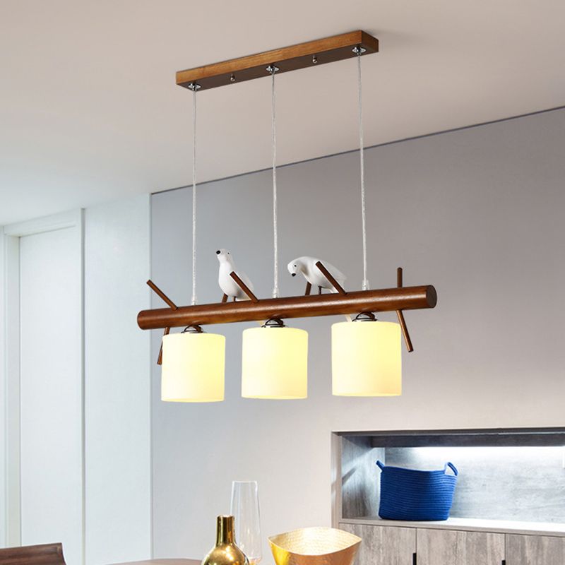 Cylinder Restaurant LED Pendant Light White Glass Simplicity Hanging Island Light with Resin Bird