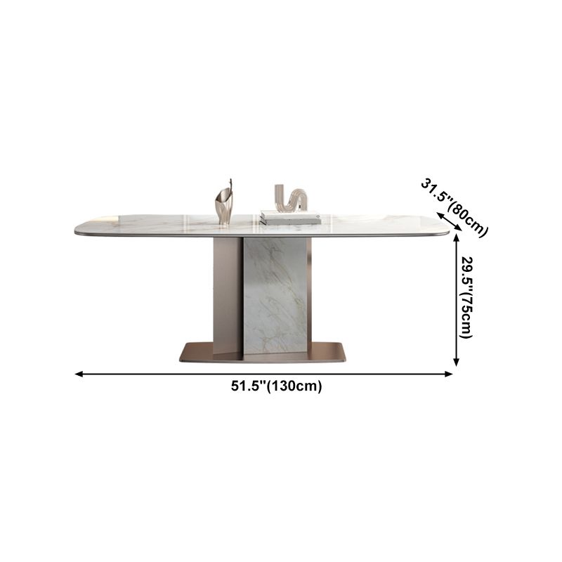 Mesa de comedor de piedra sinterizada de lujo con pedestal de metal en oro rosa