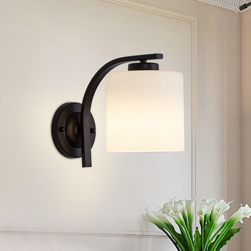 Black 1-Light Wall Sconce Simple Ivory Glass Cylinder Wall Mounted Lamp with Curved Arm