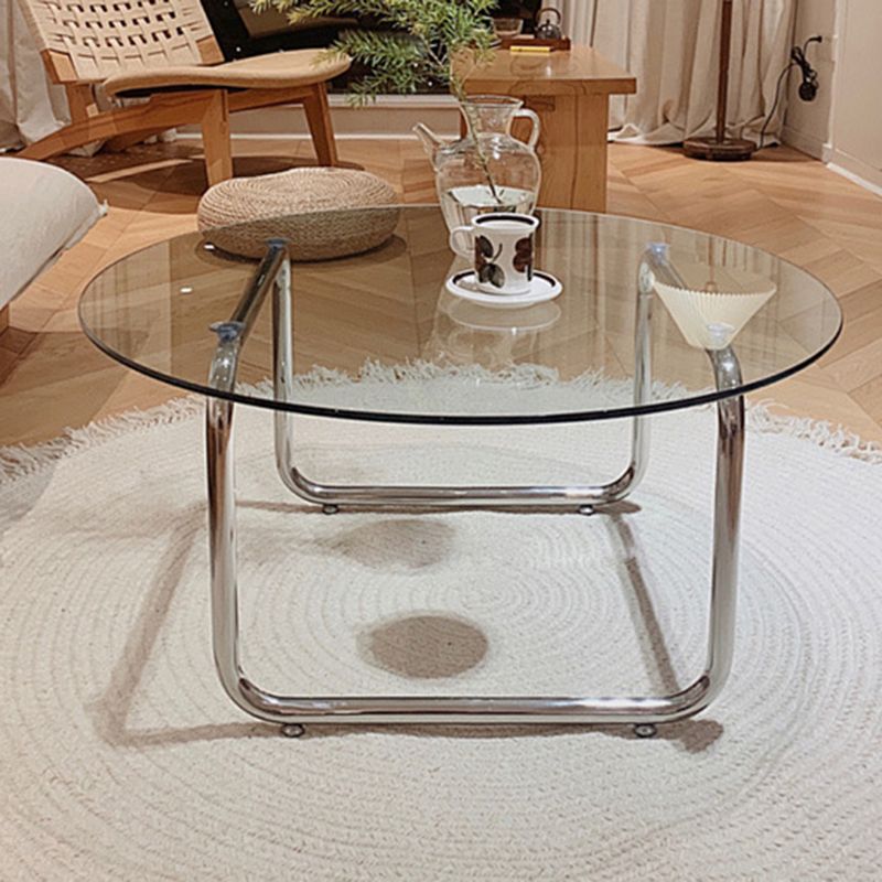 Contemporary Round Glass Top Cocktail Table with Sled Steel Base