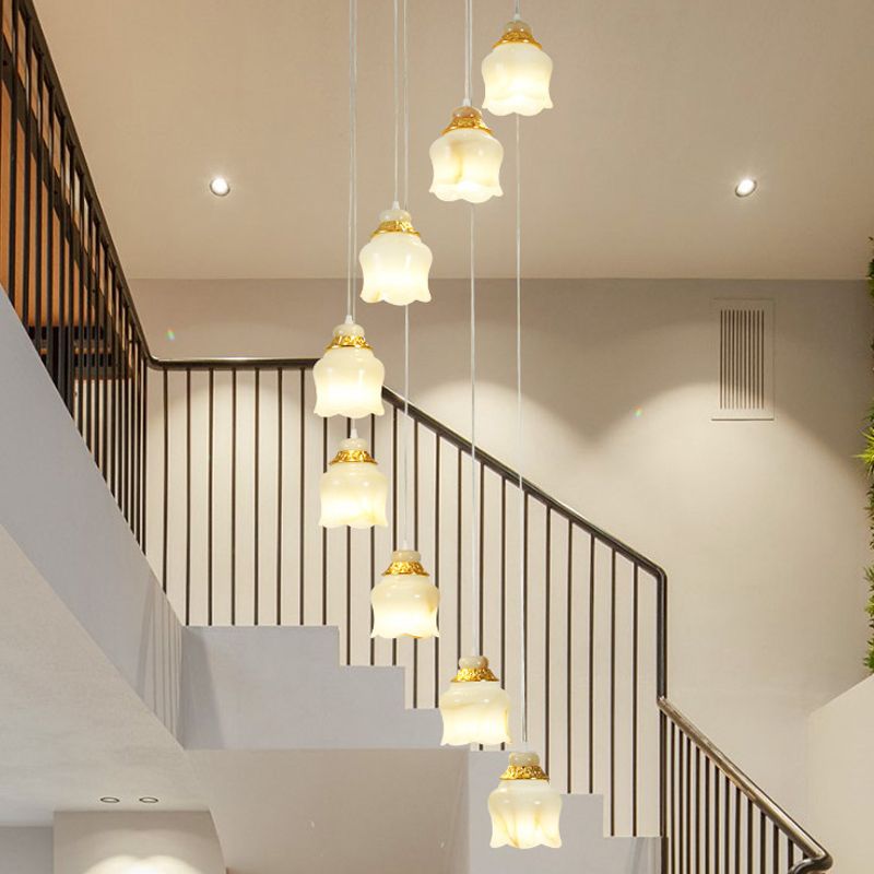 White Glass Floral Cluster Pendant Light Modernism 8 Lights Stair Hanging Lamp in Gold