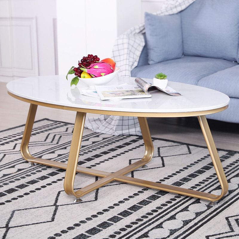 Glam Style Cocktail Table with Oval Top and Golden Iron Cross Base