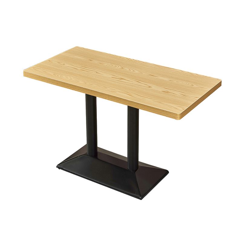 Mesa de comedor industrial de madera maciza con base de pedestal de metal
