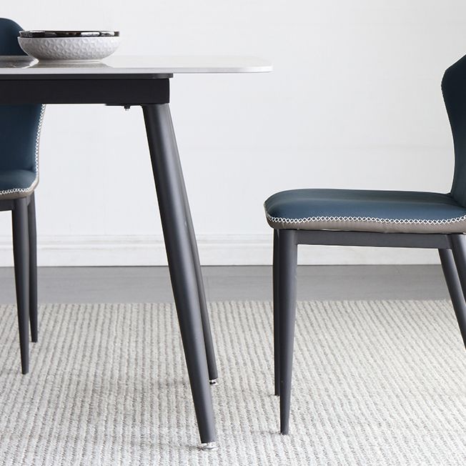Mesa de comedor estándar industrial de forma rectangular de piedra sinterizada con base de 4 patas