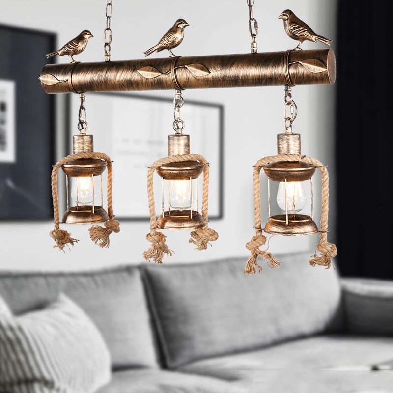 Coastal Lantern Island Pendant 3-Light Clear Glass Hanging Lamp Kit in Antique Brass with Bird