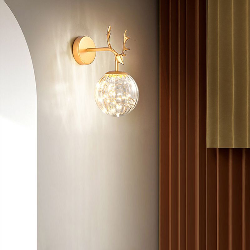 Glass Globe Wall Sconce in Modern Luxury Style Wrought Iron Wall Lamp with Antler Decoration