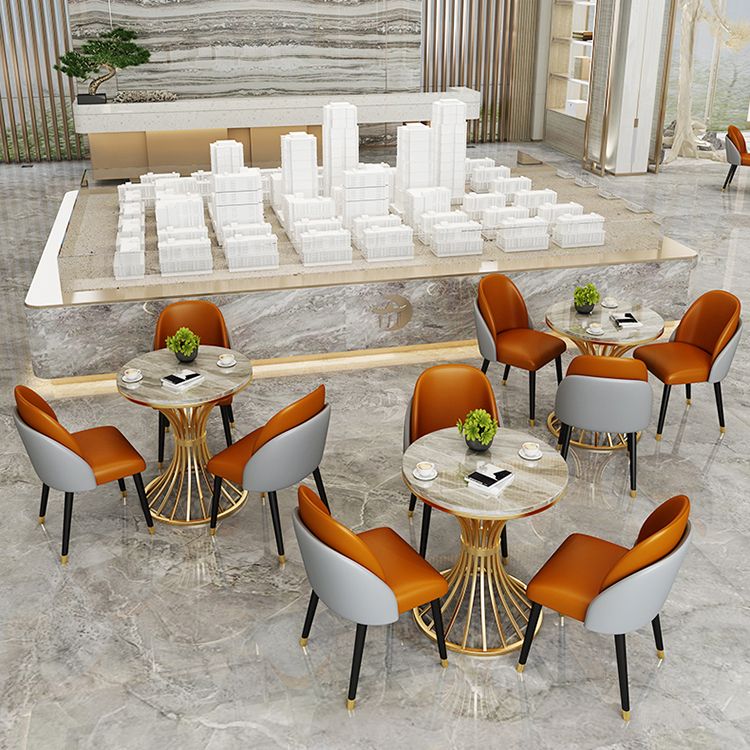 Eenvoudige stijl thuis gesinterde stenen eettafel ronde vormtafel met metalen voetstukbasis