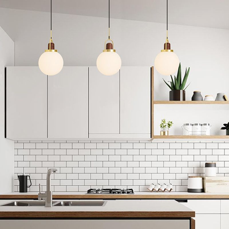 Opal Glass Ball Shade Pendulum Lamp Simple 1-Light Brass Pendant Light for Bedroom