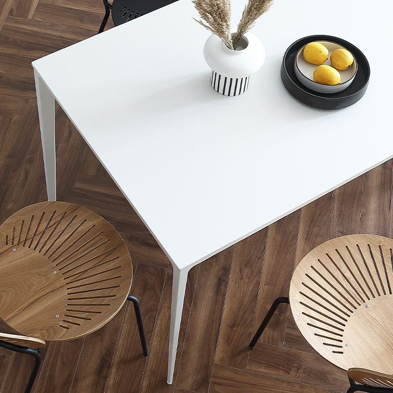 Table à manger rectangulaire contemporaine en métal blanc table de pierre fritrée avec des jambes métalliques