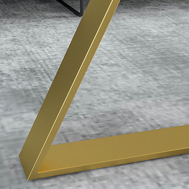 Oval Coffee Table with a Black/gold Base Made of Marble and Wrought Iron