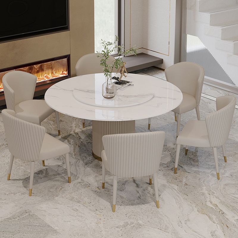 Mesa de comedor de piedra sinterizada mesa redonda de lujo con pedestal de metal en blanco