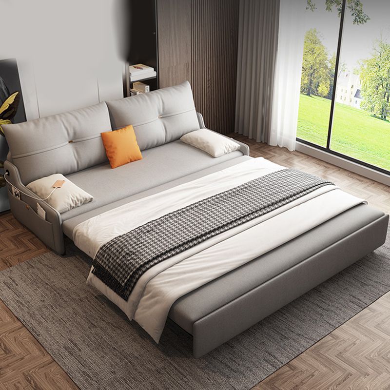 Glam Grey Futon Sleeper Sofa with Tufted Back and Storage in Faux Leather