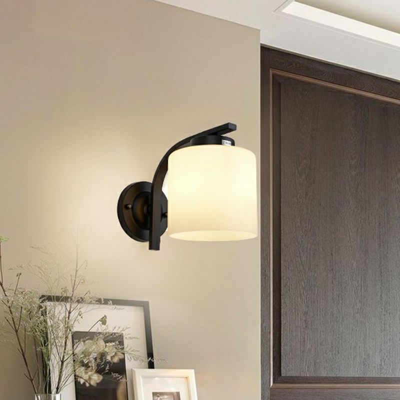 Luz de pared de cilindro de vidrio blanco Simplicidad 1 Lámpara de apliques de sala de estar de cabeza en negro
