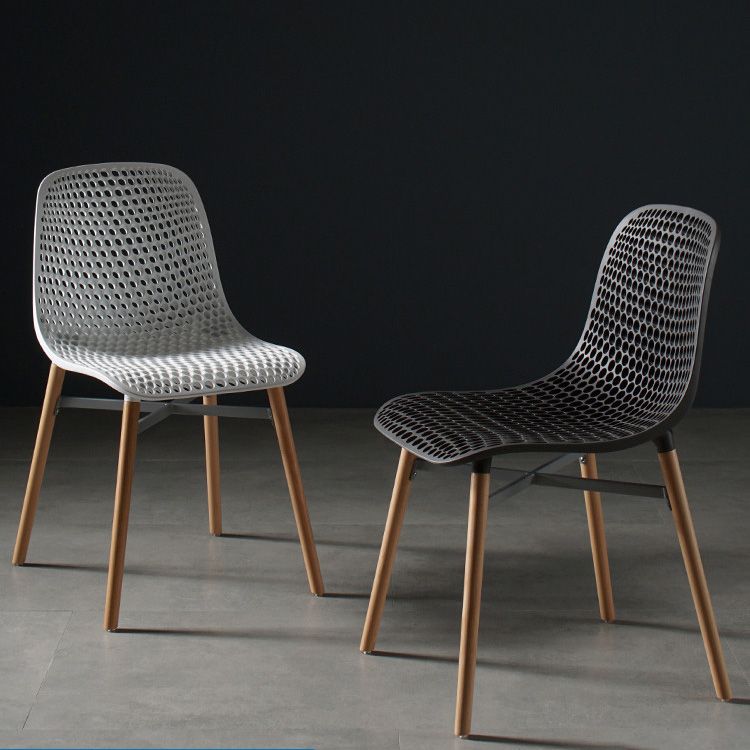 Silla de comedor de plástico de estilo escandinavo, silla sin brazos con respaldo sólido y patas de madera