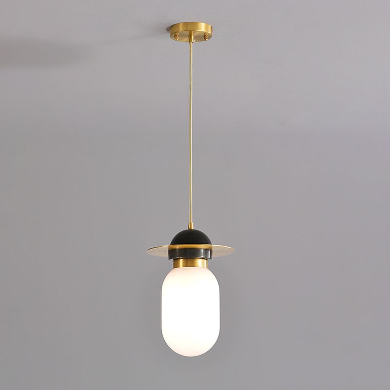 Pill Capsule Pendant Light Fixture Post-Modern White Glass Single Bedside Suspension Lamp in Brass