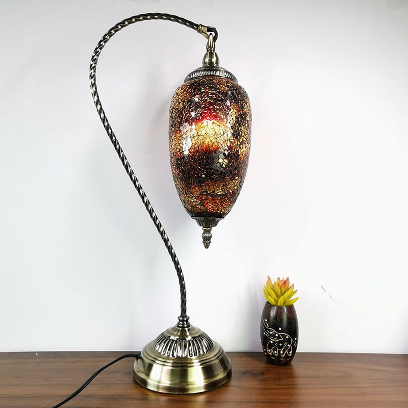 Lámpara de mesa de luz única, luz de vidrio elíptico de vidrio elíptico en bronce con brazo curvo