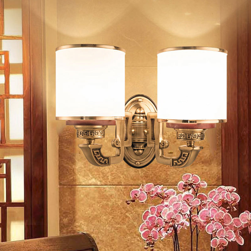 White Glass Cylinder Wall Mount Lamp Traditional 2 Bulbs Living Room Sconce Lighting in Brass