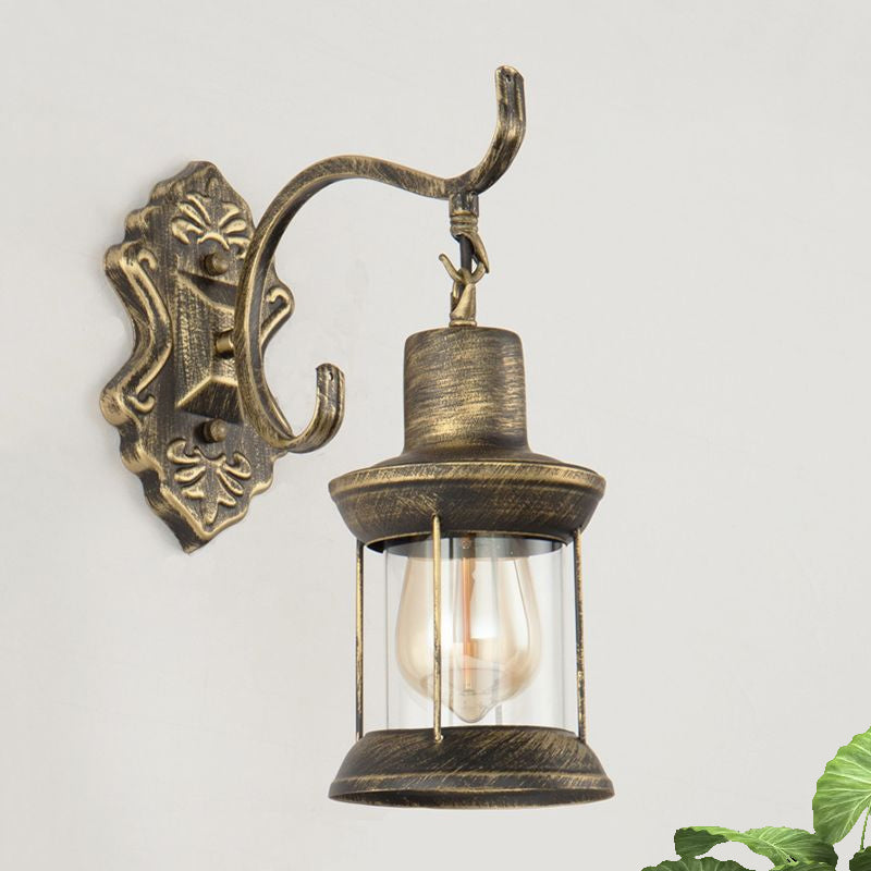 1 Bulb Kerosene Wall Mounted Light Fixture Rustic Style Aged Bronze Clear Glass Lighting with Carved Pattern
