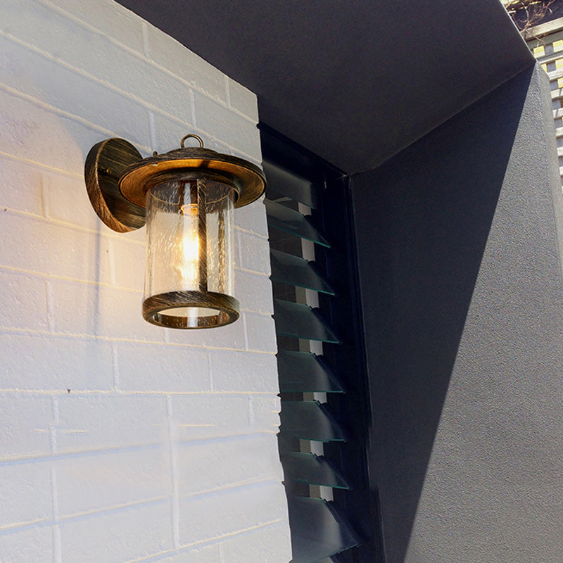 Zylinder ausgesätte Glaswandmontierlampe Industrie Industrie Einlampe Veranda Leuchte in mattem Schwarz/Bronze mit Käfig