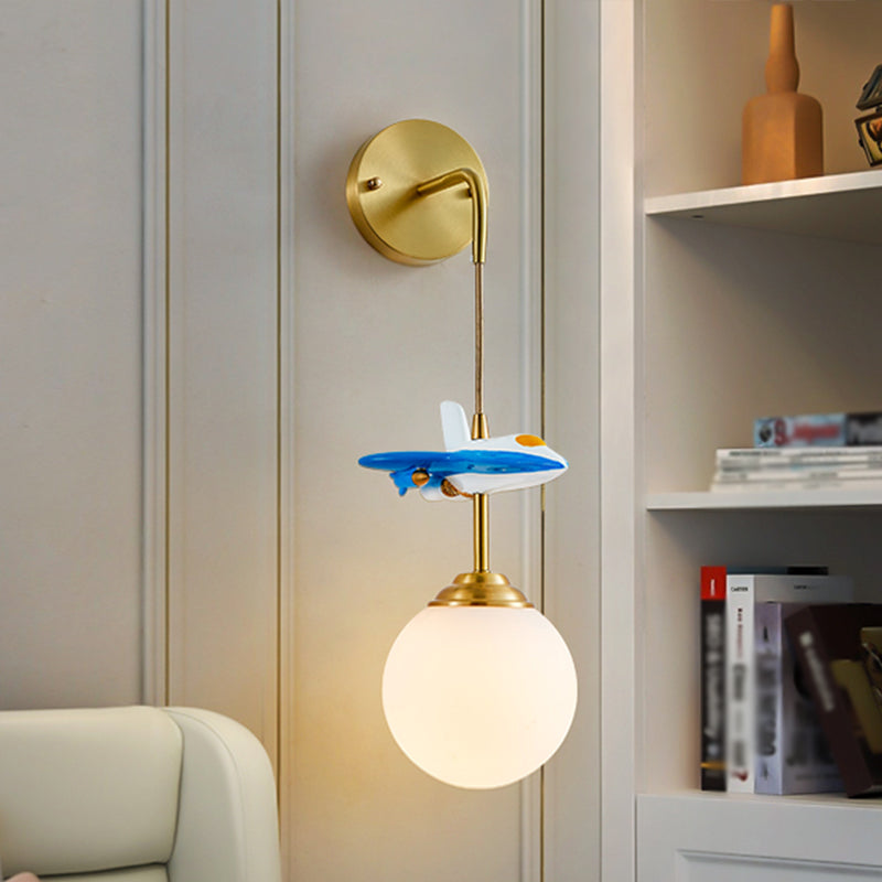 White Glass Globe Wall Lighting Cartoon 1-Light Wall Light Fixture with Plane Decor in Brass