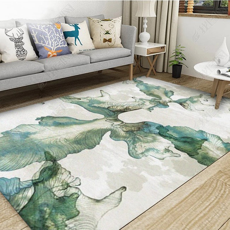 Tapis de motif botanique unique avec tapis lavable de support sans glissement gris et bleu.