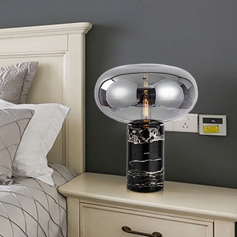 Lampada da tavolo da soggiorno ovale postmoderna in vetro grigio/ambra con 1 lampadina con base cilindrica in marmo nero