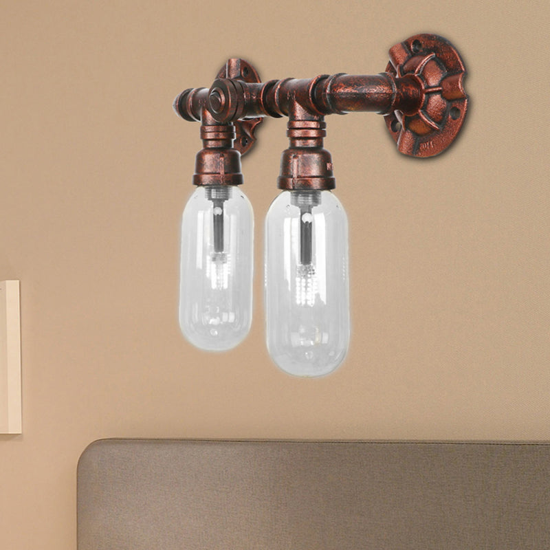 Clear Glass Capsule Sconce Lighting Industrial 2/4 Lights Bedroom Wall Mounted Pipe Light in Weathered Copper