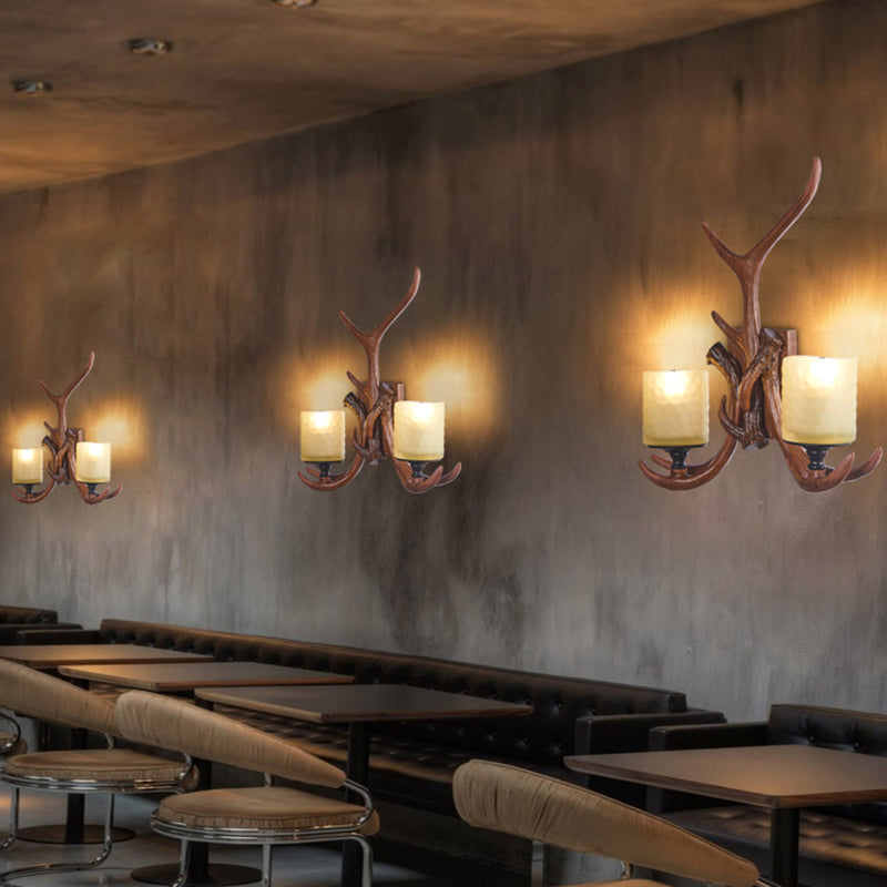 Deer Horn Resin Wall Light Vintage Restaurant Wall Mounted Lamp with Cylinder Beige Glass Shade in Brown