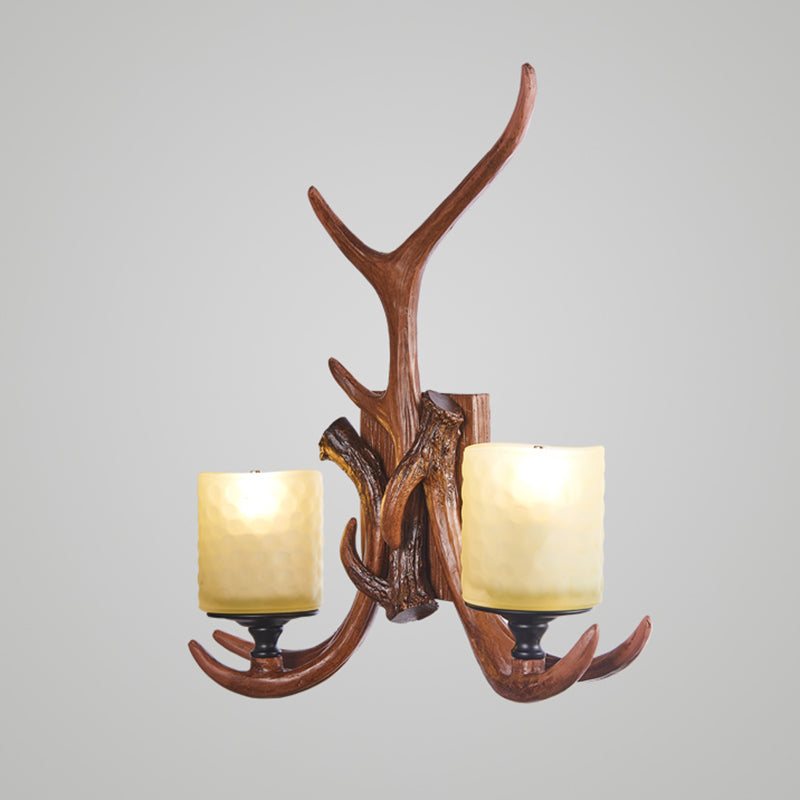 Deer Horn Resin Wall Light Vintage Restaurant Wall Mounted Lamp with Cylinder Beige Glass Shade in Brown
