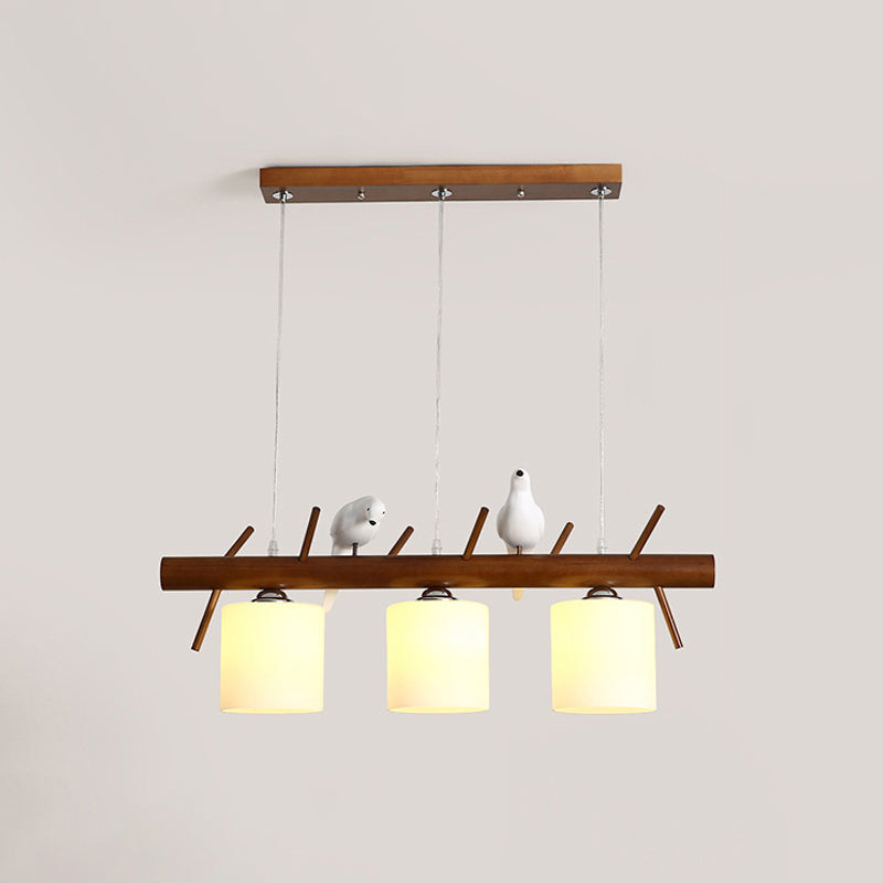 Cylinder Restaurant LED Pendant Light White Glass Simplicity Hanging Island Light with Resin Bird