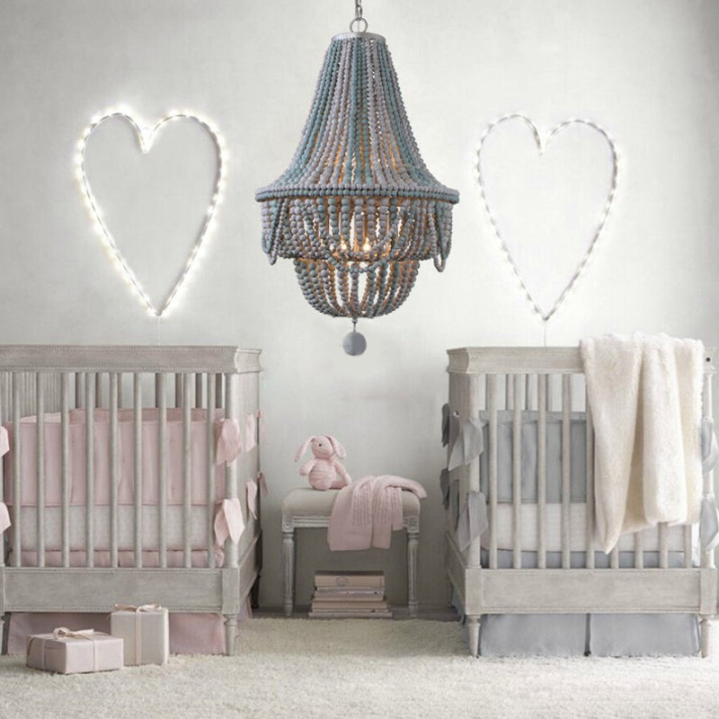 Pink / Blue Laser Cut Empire Chandelier Nordic Wood 8 Heads Pendant Lighting Fixture avec chute sphérique