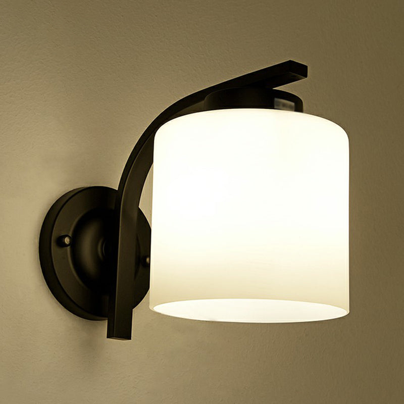 Luz de pared de cilindro de vidrio blanco Simplicidad 1 Lámpara de apliques de sala de estar de cabeza en negro