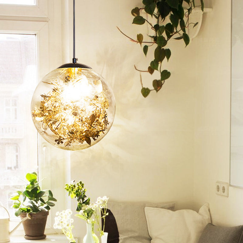 Illuminazione a sospensione globo semplice vetro trasparente a 1 teno sala da pranzo a sospensione con fiore di lamina all'interno