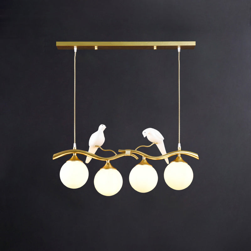 Glass Spherical Hanging Light Postmodern 4-Bulb Ceiling Pendant with Twig and Bird Deco