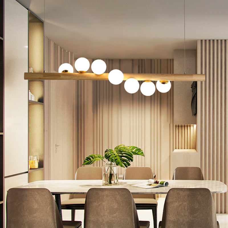 Nordic Linear Wood Island Pendant with Globe Shape Glass Island Light in Beige for Dining Room