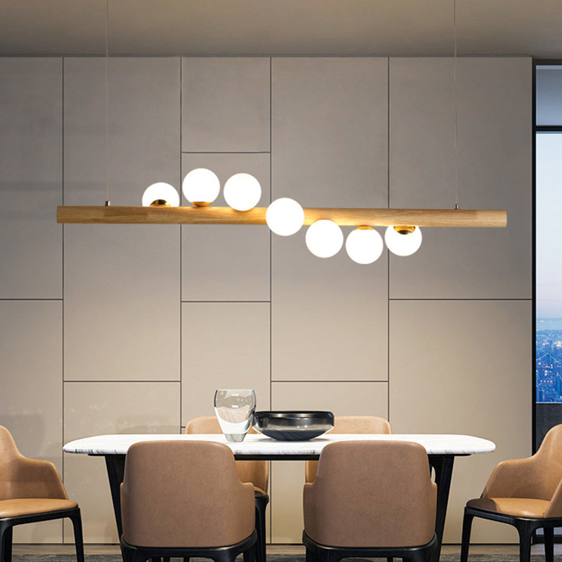 Nordic Linear Wood Island Pendant with Globe Shape Glass Island Light in Beige for Dining Room