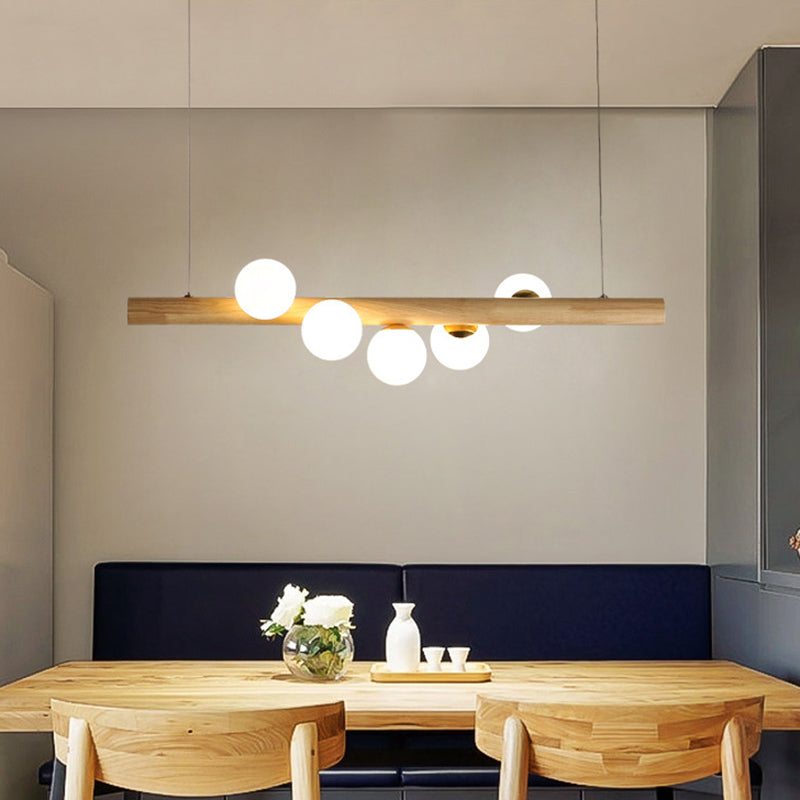 Nordic Linear Wood Island Pendant with Globe Shape Glass Island Light in Beige for Dining Room