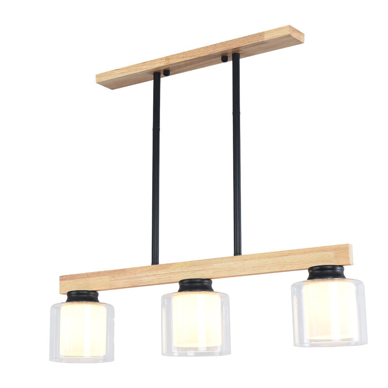 Ciondolo a isola moderna nordica con lampada da pranzo cilindrica in vetro del paralume.