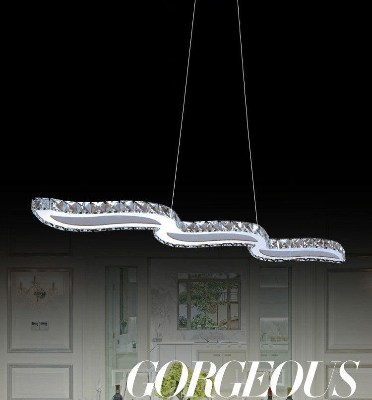 Moderno lussuoso lussuoso isola a pendente illuminazione ondata prismatica a soffitto di cristallo ottico per soggiorno