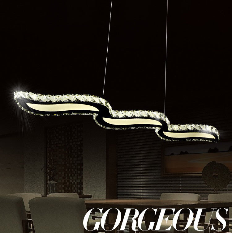 Moderno lussuoso lussuoso isola a pendente illuminazione ondata prismatica a soffitto di cristallo ottico per soggiorno