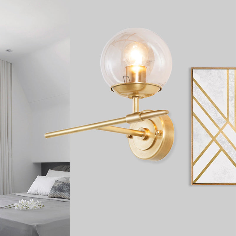 Brass Globe Wall Light Contemporary 1 Light Hand Blown Glass Sconce Light with Crossed Arm