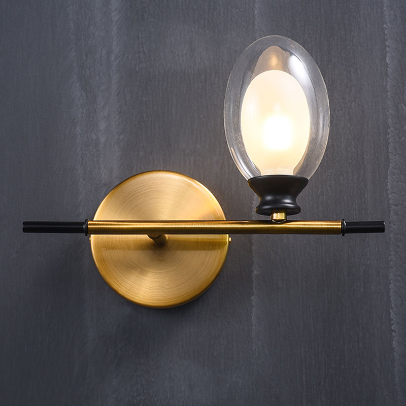 Clear/Amber Glass Egg Shape Wall Light Fixture Minimalist 1 Light Brass Sconce with Horizontal Arm