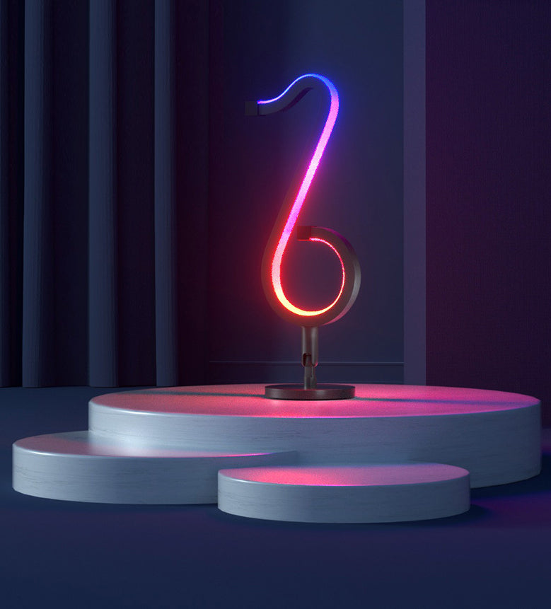 Lampada da tavolo a forma di nota musicale in metallo. Luce notturna a LED nera minimalista alla moda per camera da letto