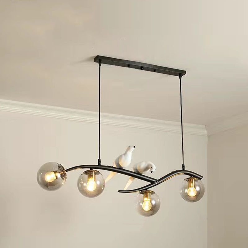 Glass Globe Island Light in Modern Singularity Wrought Iron Pendant Light with Resin Bird Decoration