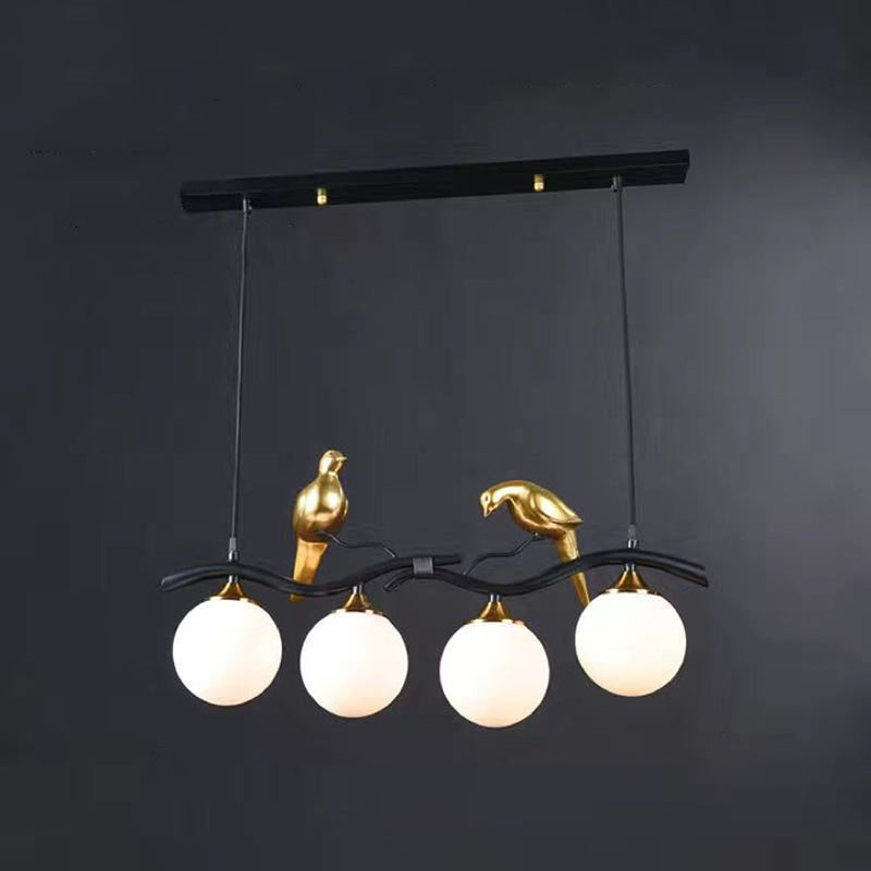 Glass Globe Island Light in Modern Singularity Wrought Iron Pendant Light with Resin Bird Decoration