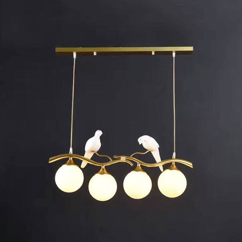 Glass Globe Island Light in Modern Singularity Wrought Iron Pendant Light with Resin Bird Decoration