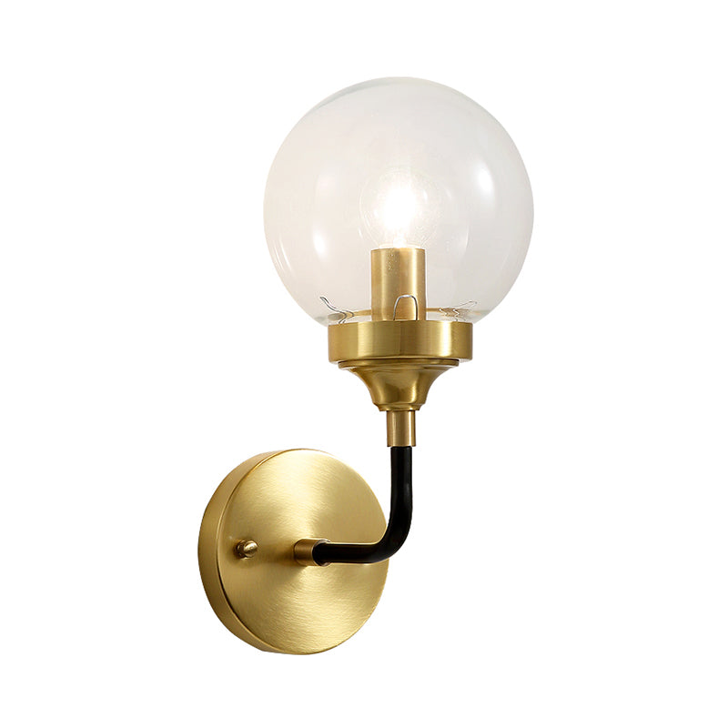 Simple Globe Wall Lighting Clear Glass 1 Bulb Sconce Light Fixture in Brass with Curved Arm