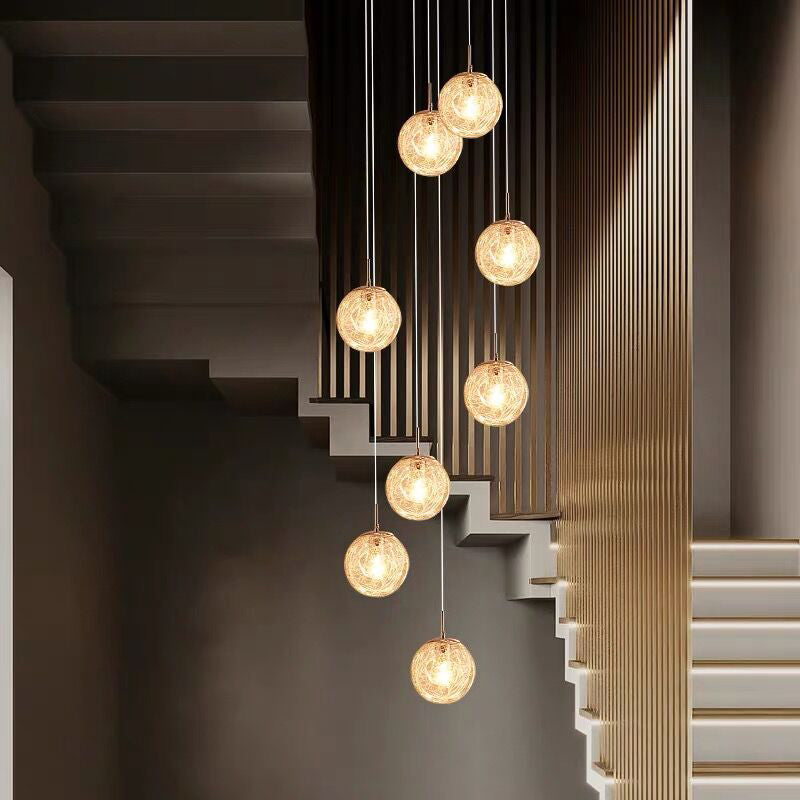 Lumière suspendue en argent dans la lampe suspendue du globe en acier inoxydable de style de luxe moderne pour les escaliers