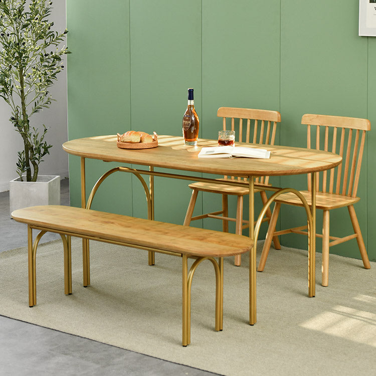 Zeitgenössischer Esstisch ovaler masser Holztisch mit metallischem vierbeinigen Tisch